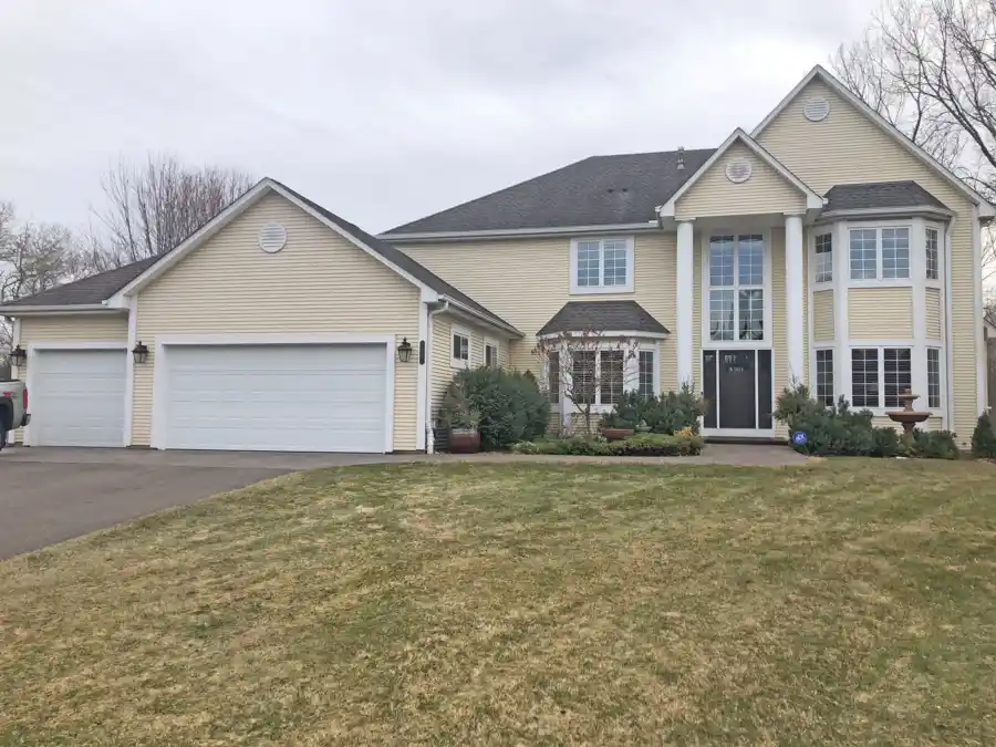 Two-story colonial before exterior redesign